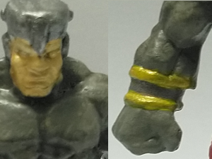 A comparison between the gold of the stone golem's face and the cold on the cuff of the wristband.