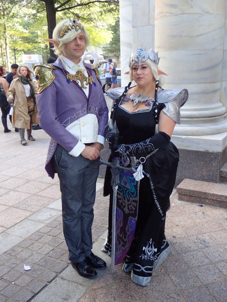 Man and woman dressed as princess zelda